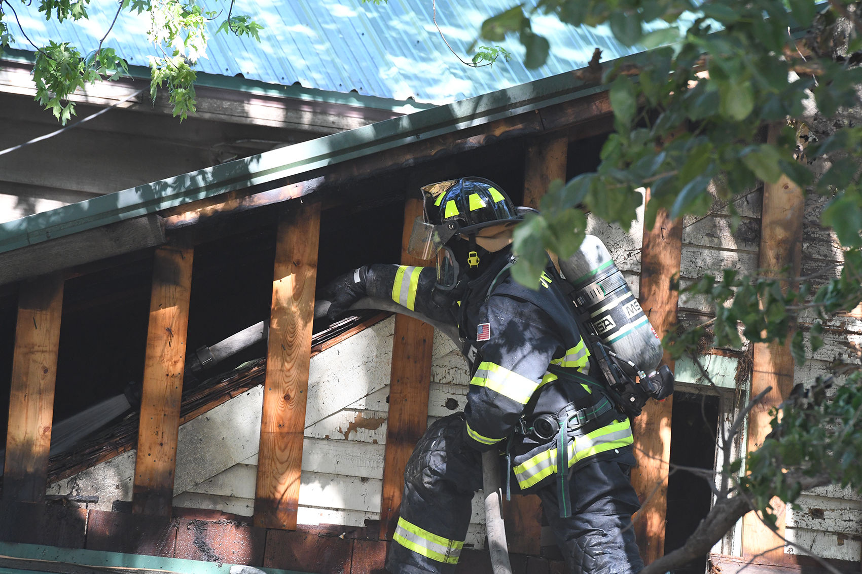 Firefighter hoses Archer house fire